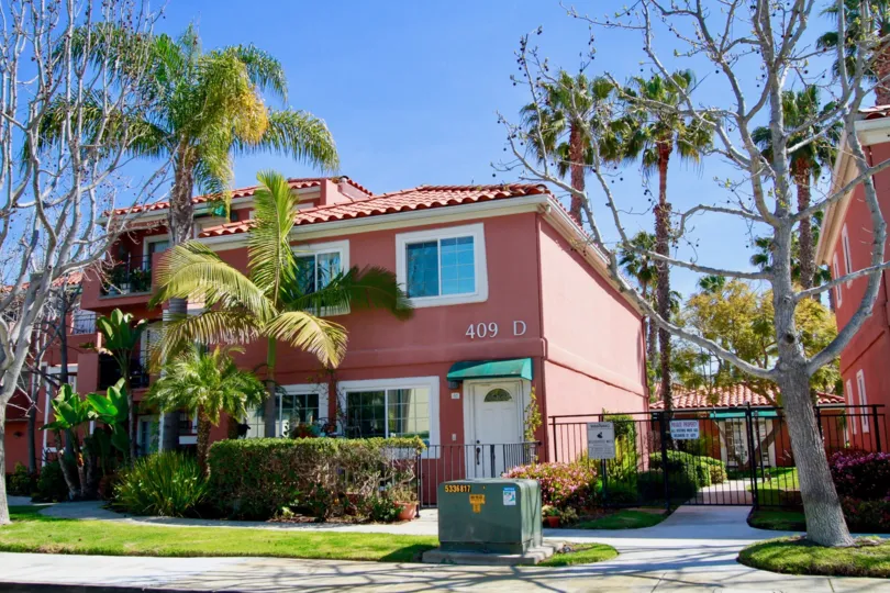 Brisas Del Mar Huntington Beach California house red color paint only window attach near to tree