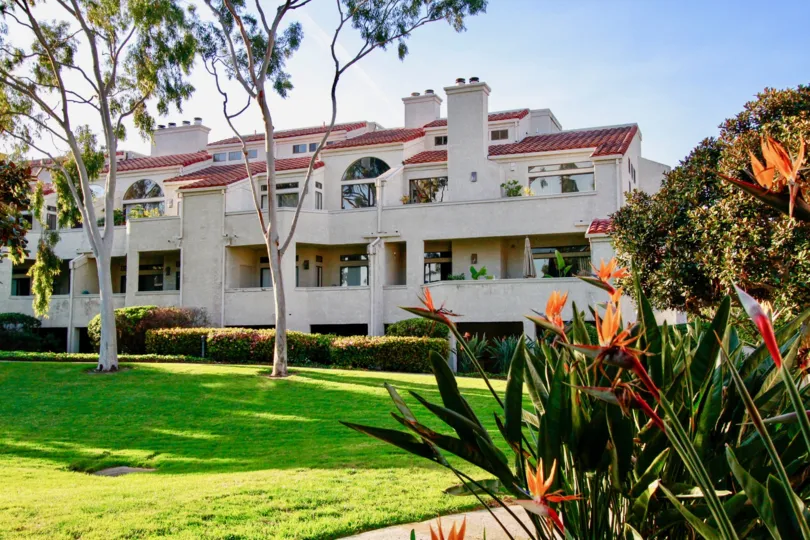 Nice Colourful view of Villas with green lawn and trees besides in Cabo Del Mar of Huntington Beach