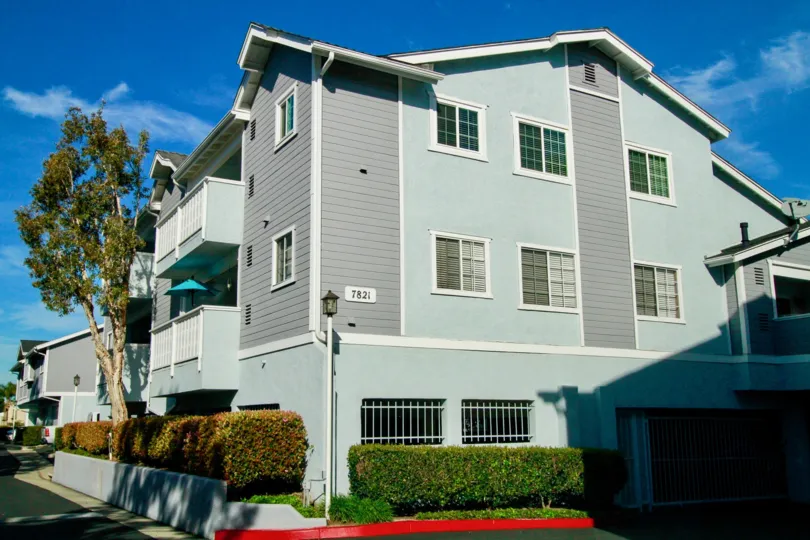 A two floor building colored with light green color