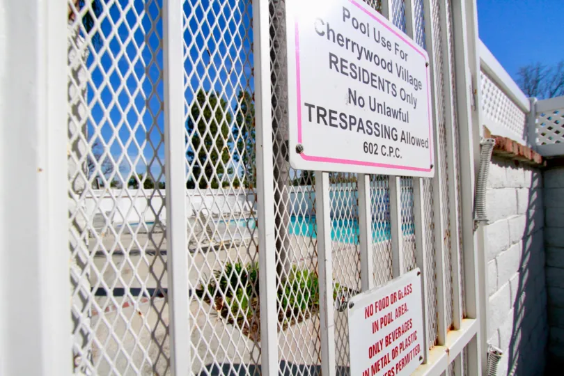 A Warning Board near swimming pool in Cherrywood Village of Huntington Beach