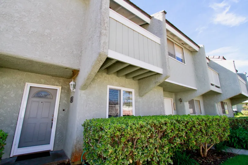 the house which is in gray colored and locate in cherrywood village of huntington beach, california