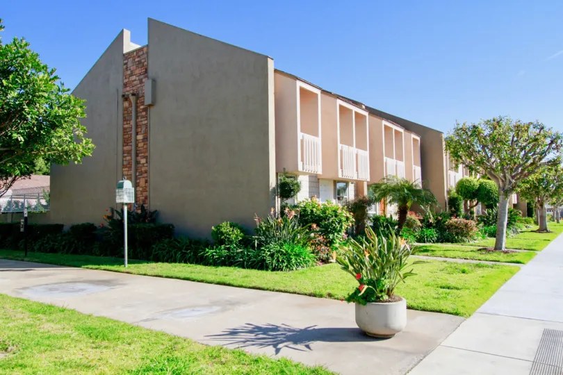Nice Green Lawn with beautiful trees around villa in Christiana Bay of Huntington Beach