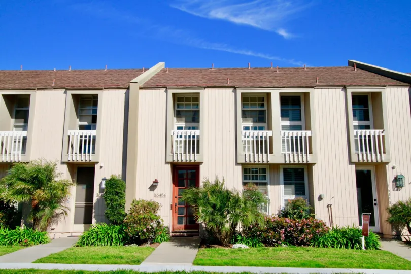Christiana Bay Huntington Beach California box type house huge balcony light rose paint and window