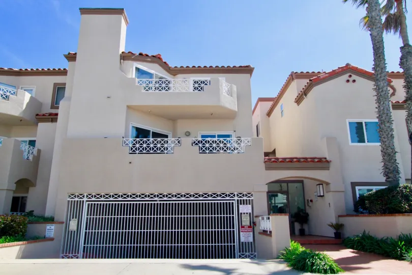 the beautiful sky above the tan stucco of the Faire Rivage community