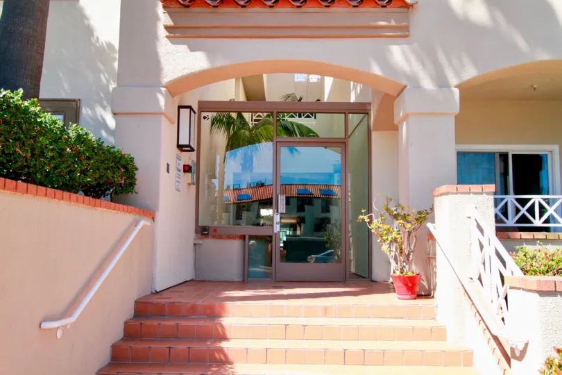 the glass entry door of a private shop of faire rivage in huntington beach, california