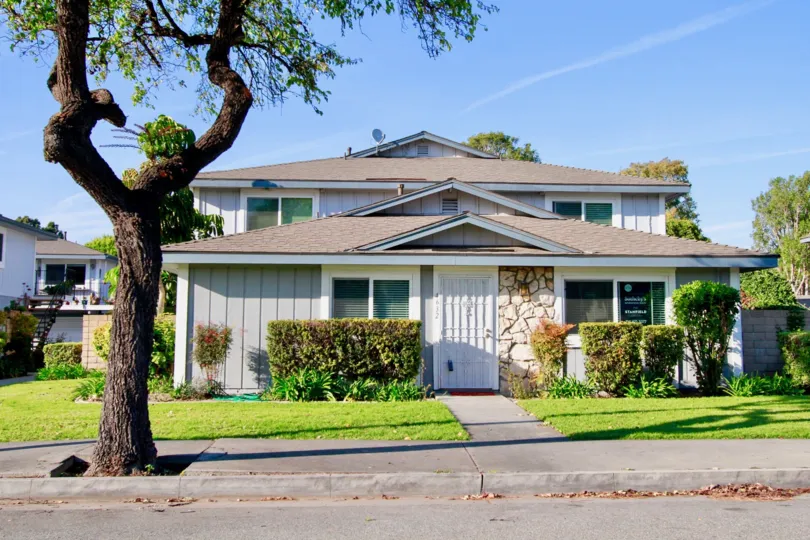 Beautiful Outer approach view of villa with trees around in Harbor Heights Villas of Huntington Beach