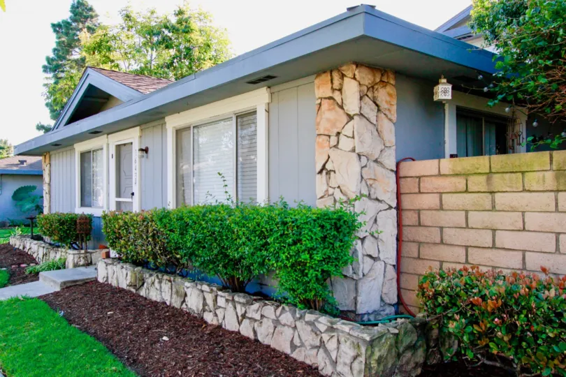 A modern looking villa with small garden in front in Harbor Heights Villas of Huntington Beach