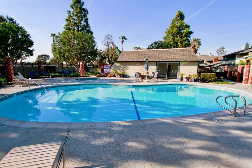 A clear pool under the blue sky at the Harbor Pines community