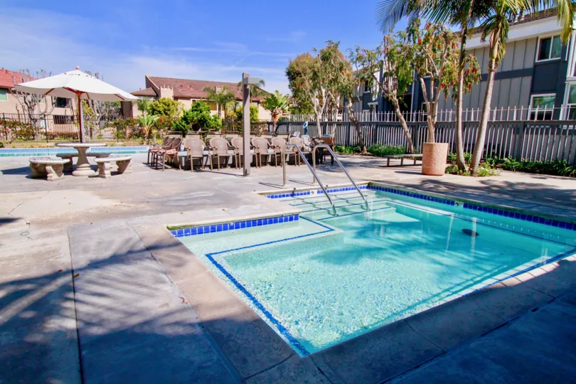 THE HARBORING VILLAS IS HOUSE INFORNT OF TREES IS NICE IN HUNTINGTON BEACH IN CALIFORNIA