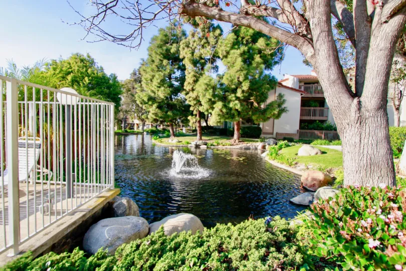 Beautiful Fountain place with small pond with trees near villas in Harbour Vista of Huntington Beach