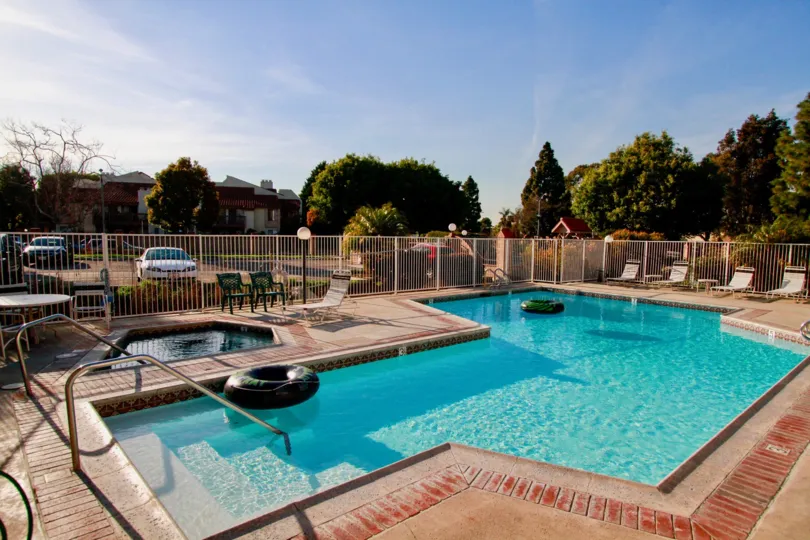 Beautiful view of swimming pool with trees around in Harbour Vista of Huntington Beach