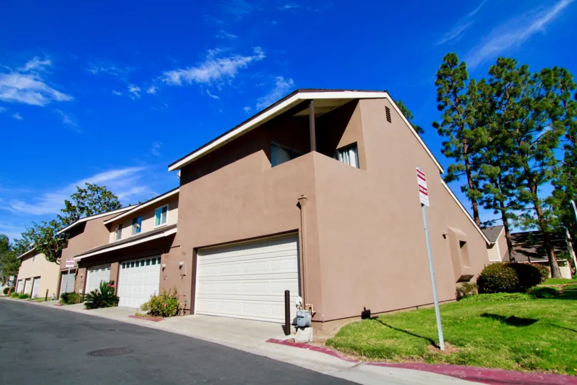 Excellent sky view of a villa with lawn and trees in Huntington Cove of Huntington Beach