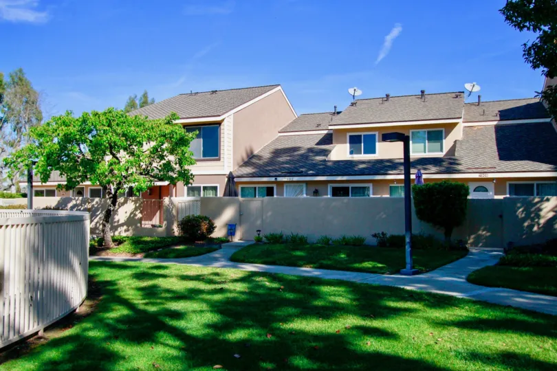 The Beautiful home in the Huntington Cove is look like a palace with super ventilation with lots of trees and plants and also with lawn.
