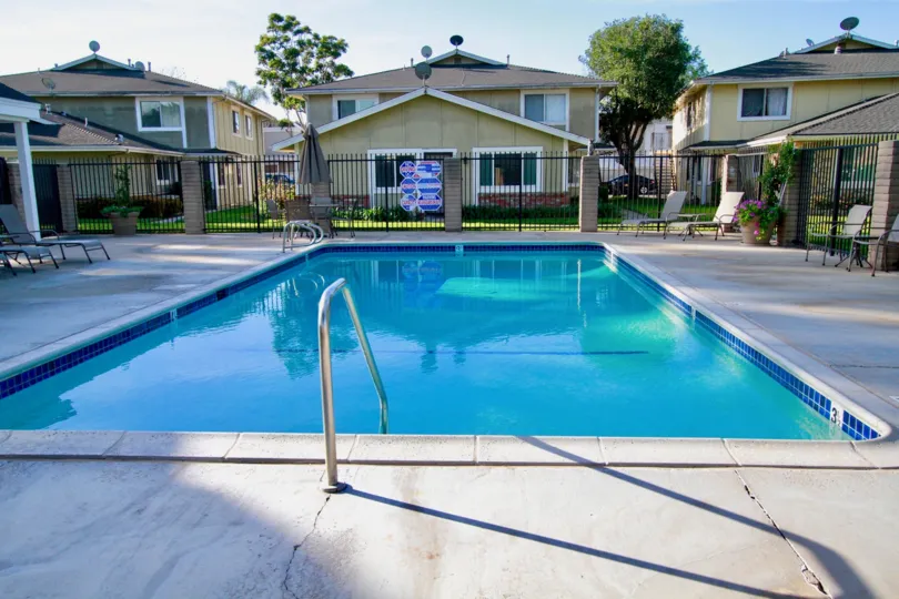 Beautiful looking swimming pool with sitting between villas of Huntington Gardens of Huntington Beach