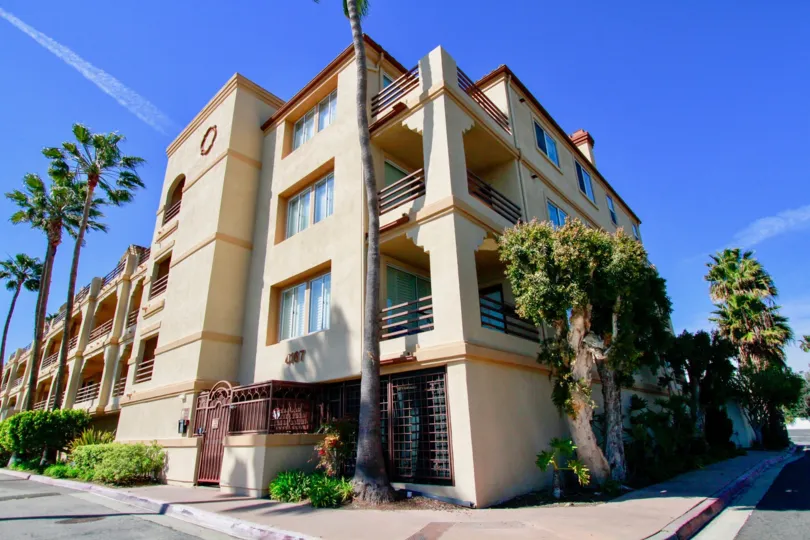 Excellent sky view of an apartment with palm trees around in Huntington Harbour Bay Club