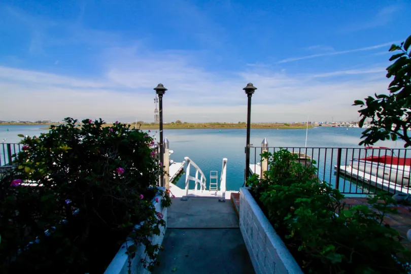 Huntington Marina Huntington Beach California building is not view light white color paint apply house front big river and steps attached light post attached