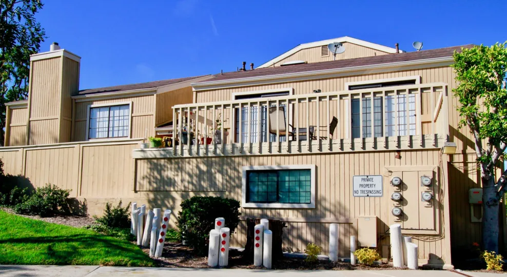 Huntington Terrace building with a balcony on a sunny day.