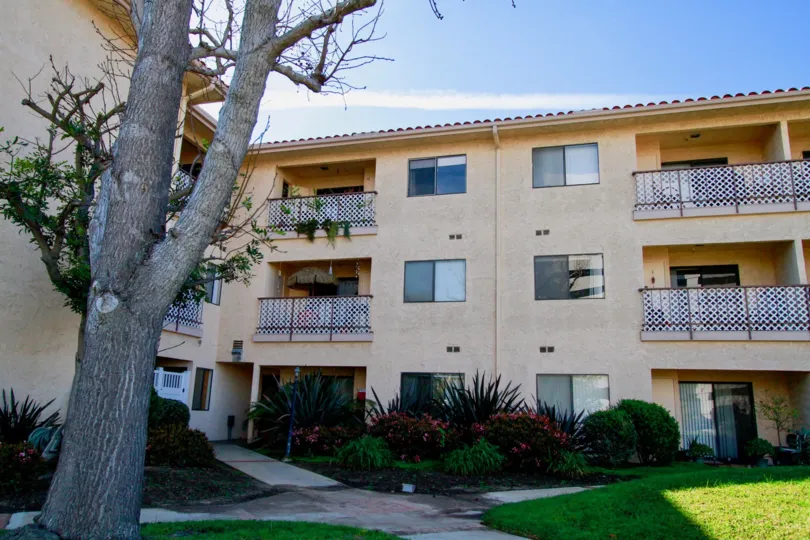 Villa having balconies and lawn in front of Huntington West of Huntington Beach