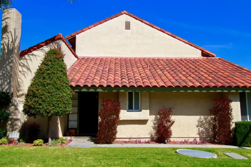 Fabulous view of vllla with variety roof top and lawn in front in La Cuesta Racquet Club of Huntington Beach