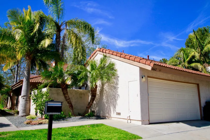 Excellent greenish view of palm trees and lawn near villa in La Cuesta Tennis Club of Huntington Beach
