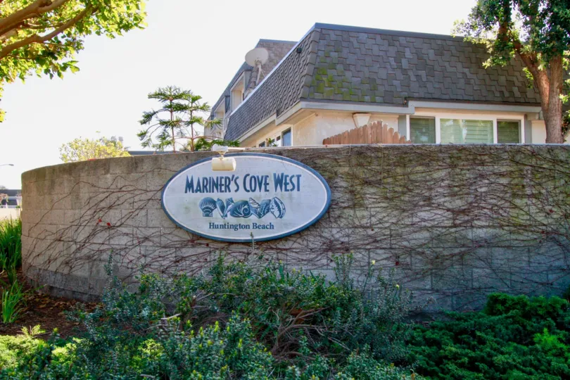 Awesome view of a villa with Name board and trees around in Mariners Cove West of Huntington Beach