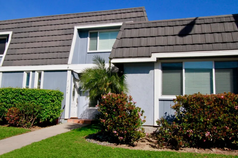 A blue residential building in Mariners Cove Community.