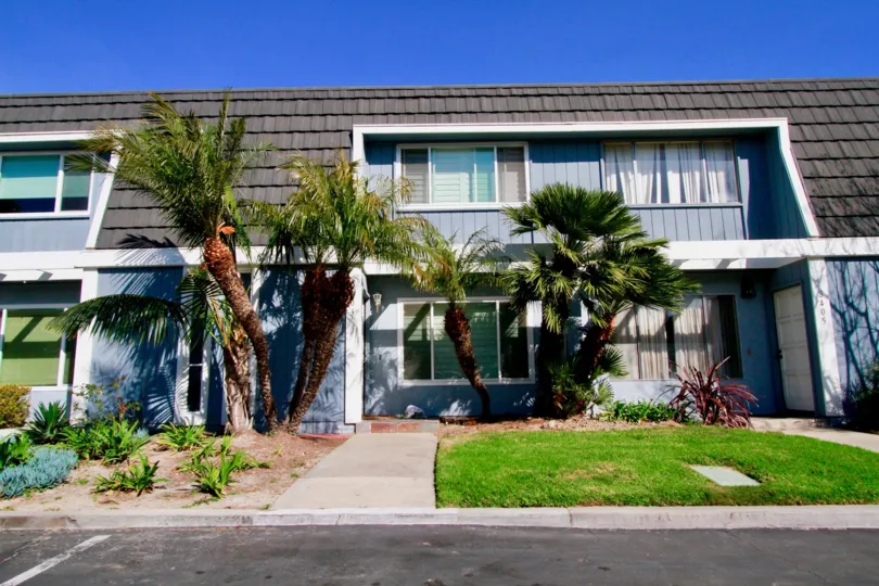 The Mariners Cove with glass windows and small trees beside