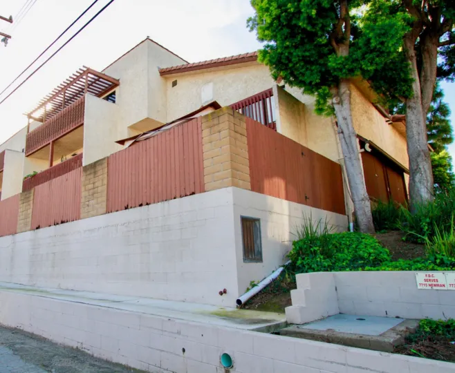 Excellent view of a villa with balcony and trees nearby in Newman Terrance of Huntington Beach