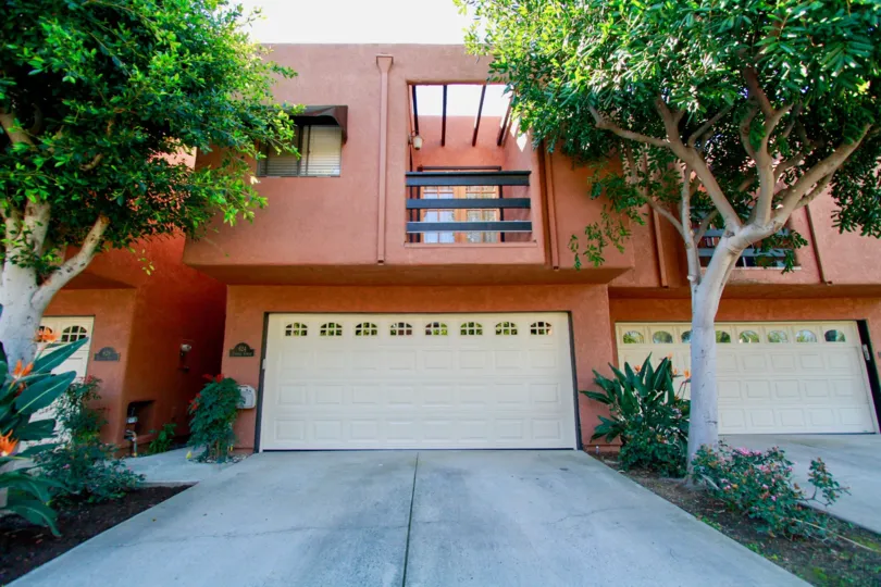 Pacific Terrace Huntington Beach California beach like house with dominating trees at both side