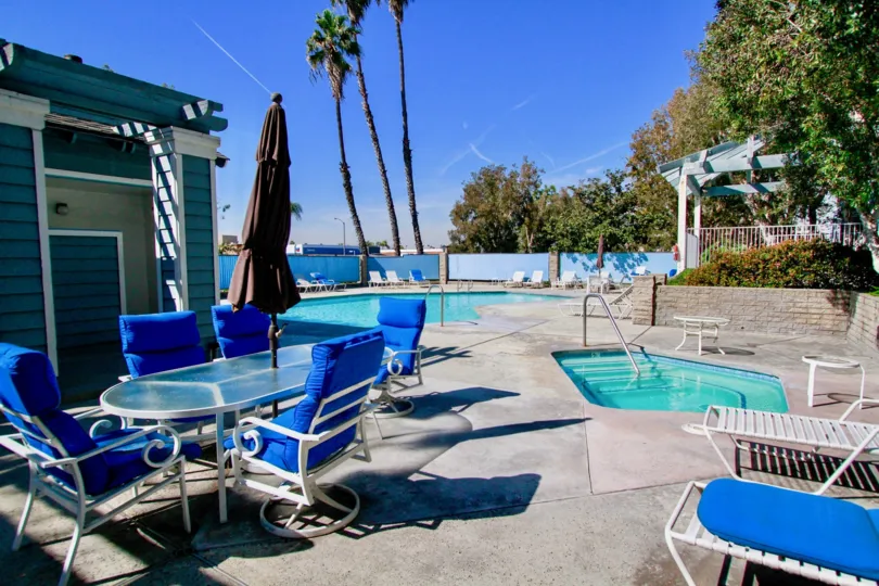 the pelican cave has lot of shaded umberla in the swimming pool which is in huntington beach, california