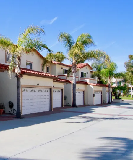 A BEAUTIFUL HOUSE WITH MORE TREES AND IT LOOKS LIKE MEDIUM SIZE BUILDING AND ONE HOUSE ALSO AVAILABLE AT THE RIGHT SIDE THE SKY LOOKS LIKE HOT