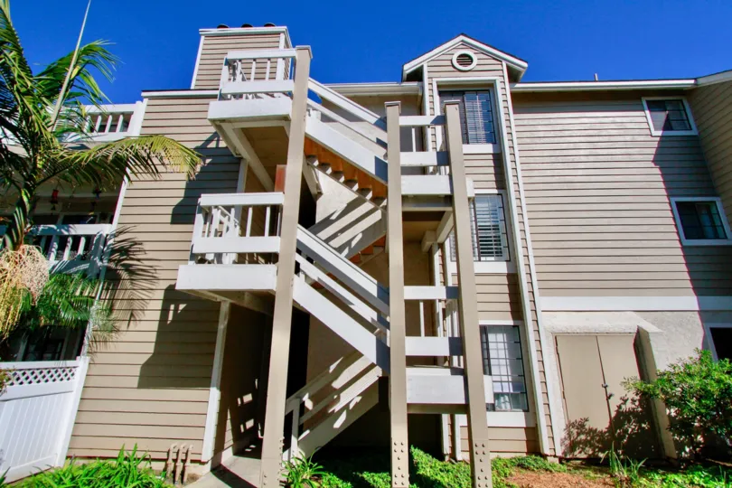 Pointe Surfside apartment building staircase on a sunny day.