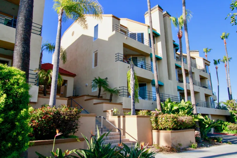 the hotel which has lot of steps and tree in front of it is locate in portofino cove of huntington beach california