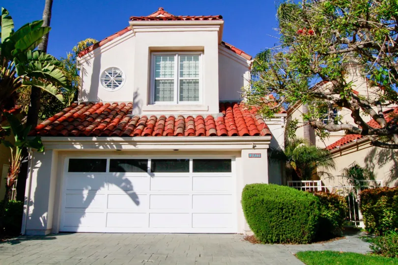 Portofino Cove Huntington Beach California building color light rose color bricks color attahed some place side place huge tree