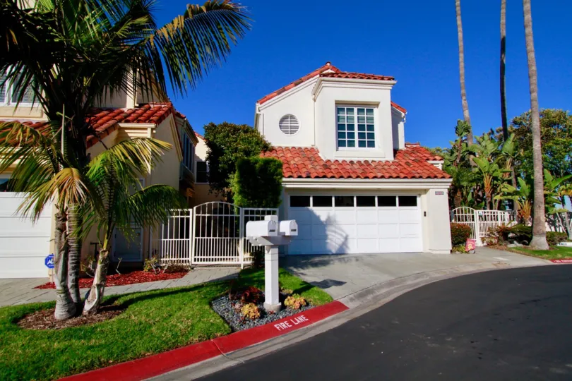 A curbside view of a family house in Portofino Cover, California.