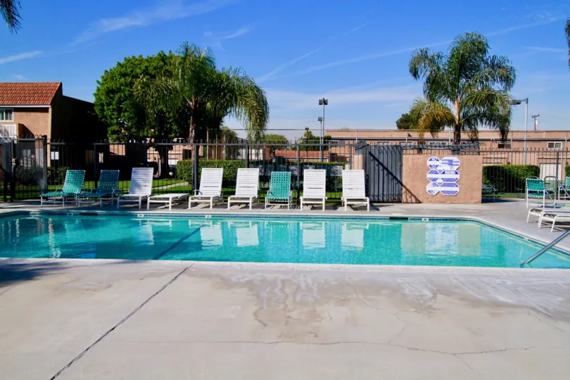 Riviera Huntington Huntington Beach California building brown paint steel door attached swmming pool bench water attached