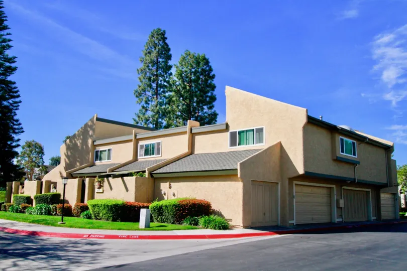 Town Homes at Sea Breeze Village with garages on the side and a minimal community yard