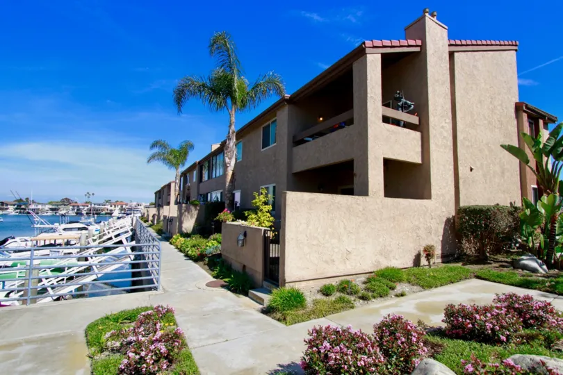 Sea Harbour apartments next to a ocean harbor on a sunny day.