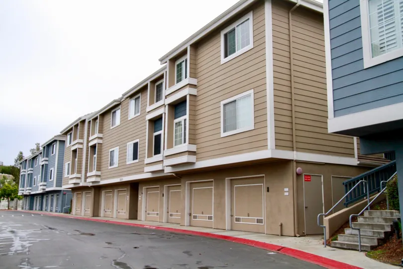 Seabridge Townhomes Huntington Beach California building is biscuts color and blue paint apply glass window attached steps attached