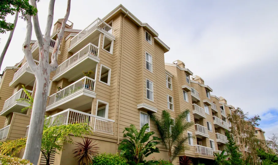 The multi stair buildings in the Seabridge Villas with big trees, ornamental plants and shrubs.