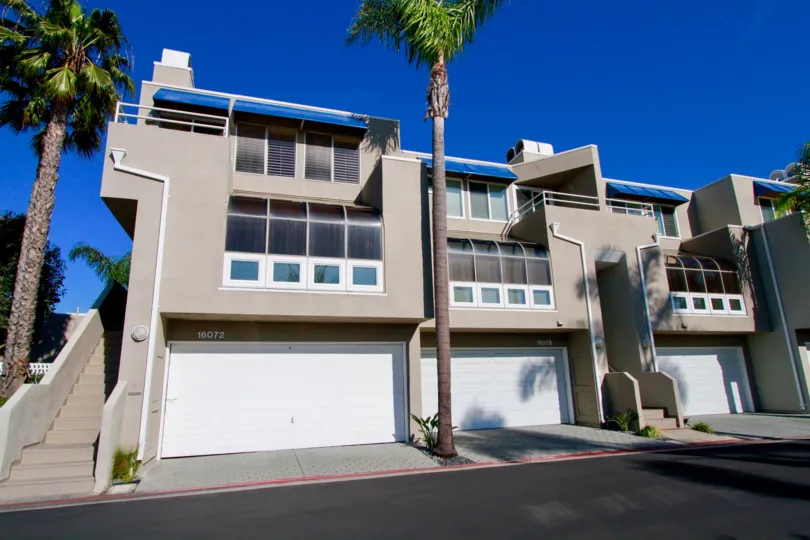 Seabridge buidling with a staircase and garages on a sunny day.
