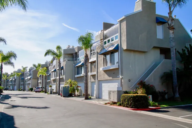 Seabridge street with a row of apartments on a sunny day.