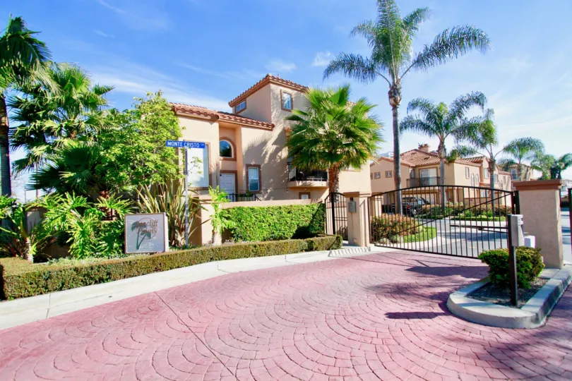 the seacliff palms the house infornt of the plam trees is lookingnice in huntington beach in california