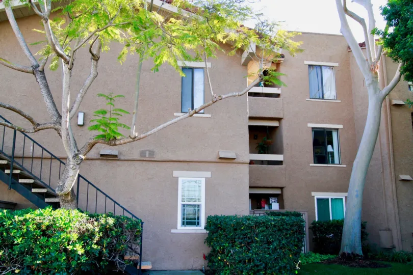 Seaspray apartments located in Huntington Beach California on a sunny day but protected by shade from trees