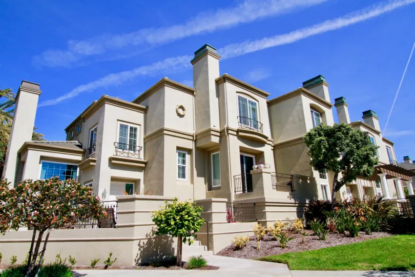 A large residential building with beautiful lanscaping in Surfcrest community.