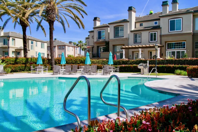 A view of the community pool and townhomes at Surfcrest in Huntington Beach, CA
