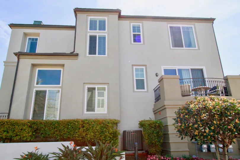 Surfcrest Huntington Beach California building color light window and glass attached house near compont wall and steel attached