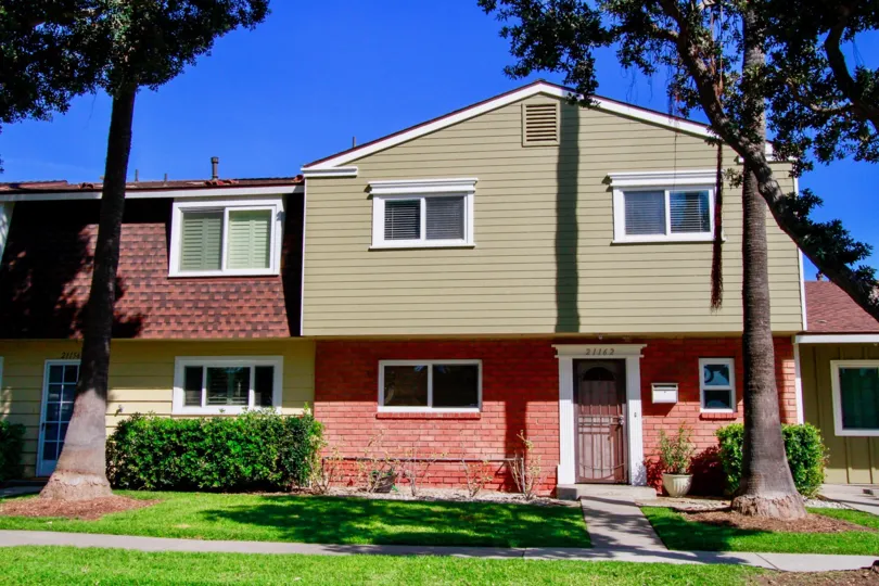 Surfside Huntington Beach California building color light biscuts and bricks color paint window and glass attached