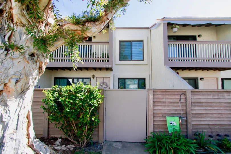 A beautiful home in the Tamarack Village with trees and plants.