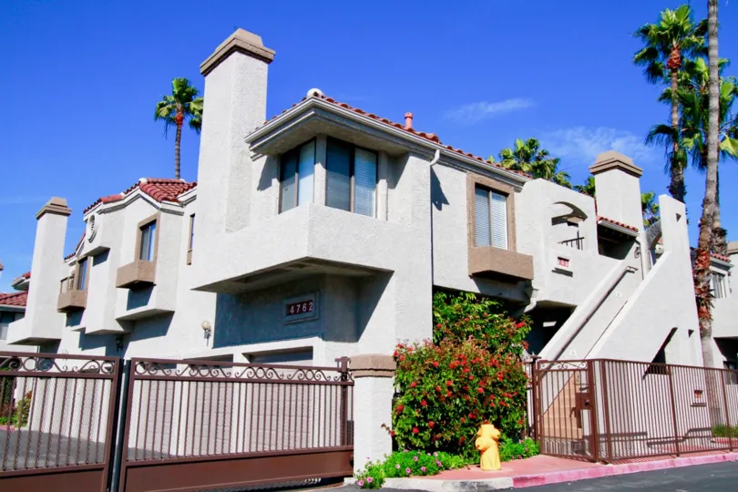 Tiara De La Pacifica Huntington Beach California building is light white paint steel wall window attached back side tree